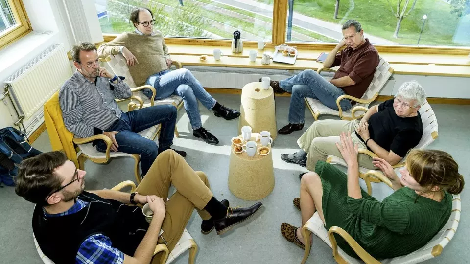 Researchers around a "fika" table.