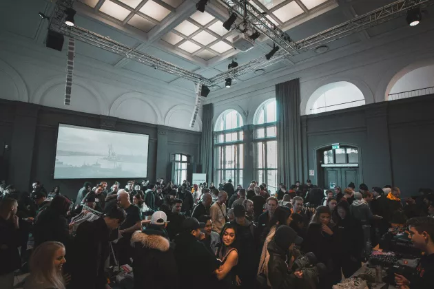 People mingle in a conference hall