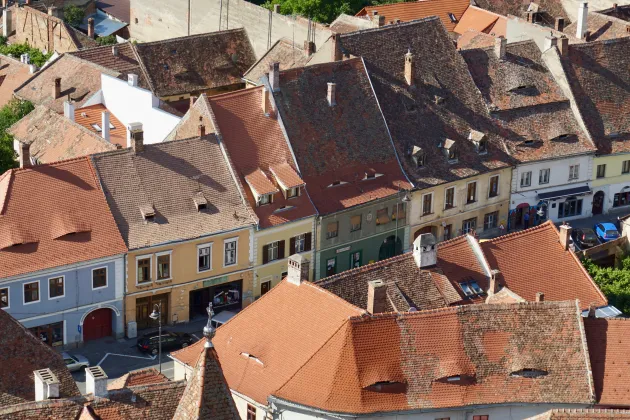 Small road houses on a narrow street in Sibiu, Romania.