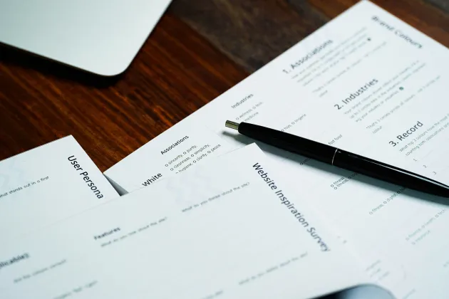 Application papers and a pen
