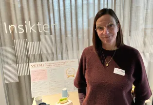 Woman in front of a glass wall